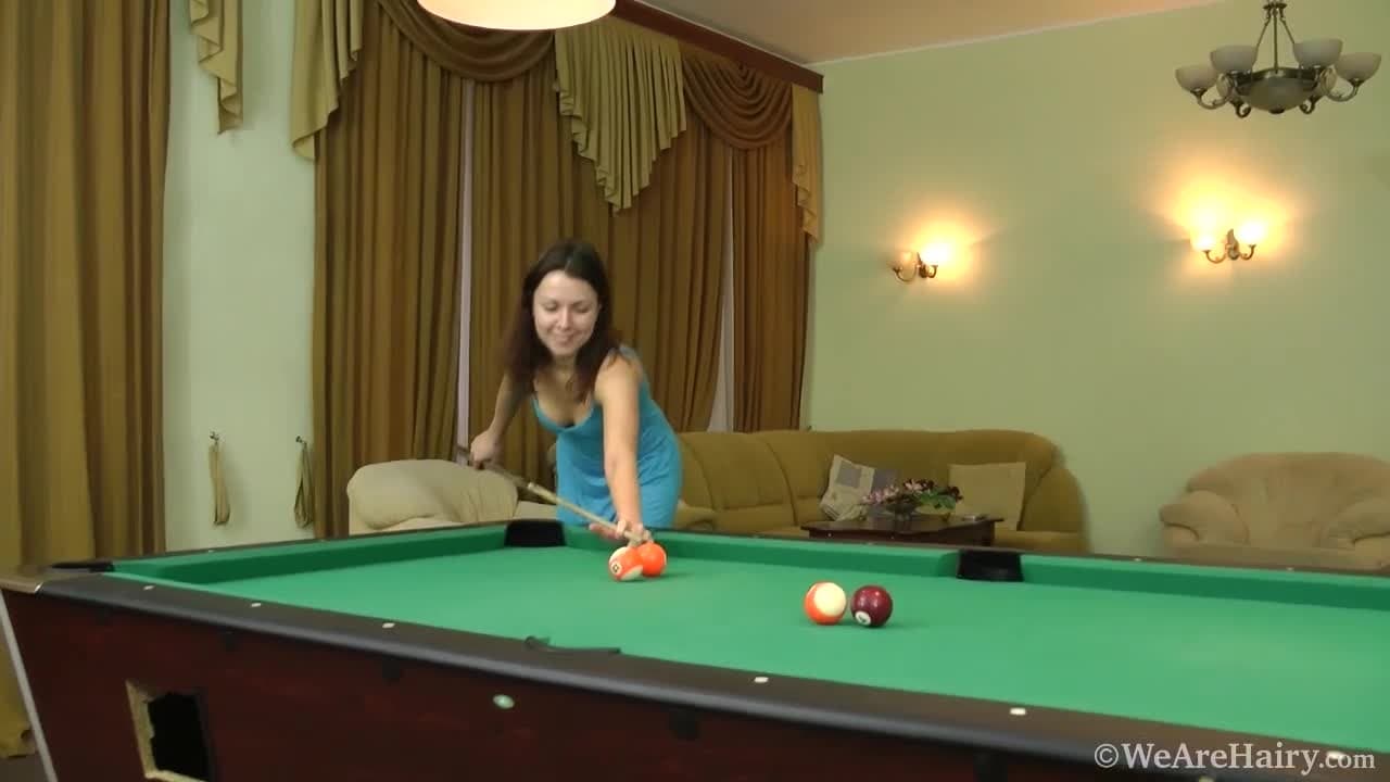 Roxy fingers her hairy pussy on a pool table