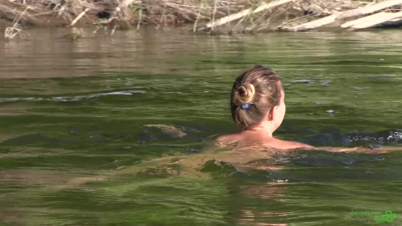 This woman loves to be nude in the river