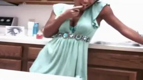 Showing her nice tits in the kitchen
